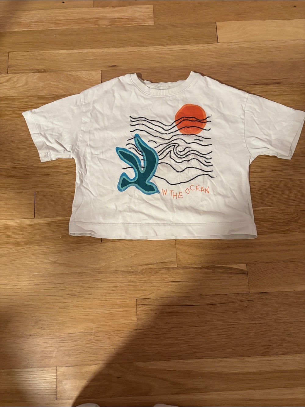 Zara White Tee with Teal Sea Creature and Orange Sun